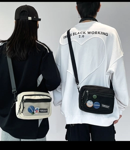 Detail of compact utility crossbody bags featuring mesh pockets and adjustable nylon straps