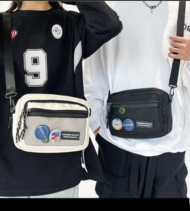 Dual view of casual canvas crossbody bags in beige and black with mesh pocket and strap