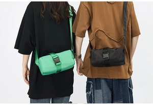 Nylon crossbody gym bag showing buckle detail and adjustable strap on male and female models