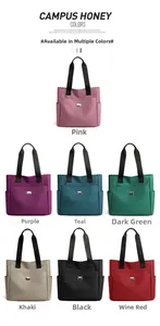 Plusieurs couleurs de sacs fourre-tout minimalistes en tissu oxford présentés en matrice