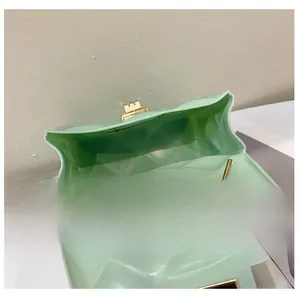 Detail view showing the spacious interior of mint green quilted jelly bag with gold lock