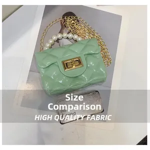 Size comparison of mint green mini quilted pearl handbag with gold chain strap