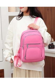 Pink casual nylon backpack for women featuring multiple practical zipper pockets