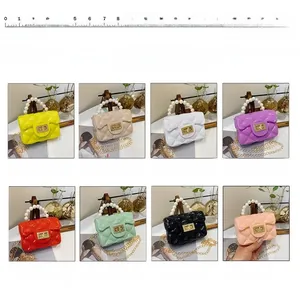 Mini quilted pearl handle chain bags in various colors shown with a size scale