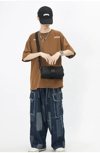 City boy style black canvas crossbody bag paired with streetwear fashion outfit
