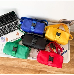 Collection of nylon crossbody bags in multiple colors featuring buckle closure and wide strap