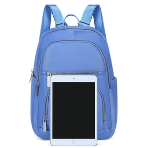 Minimalist sky blue waterproof backpack with multiple zip pockets and tablet storage space
