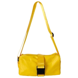 Detail view of the yellow oxford fabric bag featuring a black plastic buckle and strap