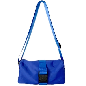 Detailed view of blue oxford crossbody bag featuring adjustable strap and buckle closure