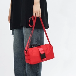 Minimalist red nylon crossbody fitness bag with adjustable strap for casual daily use