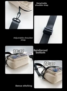 Detail of beige canvas crossbody bag featuring black mesh pocket and adjustable strap