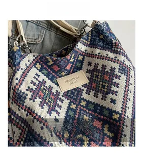 Detail of ethnic jacquard woven fabric with geometric patterns and leather fashion tag