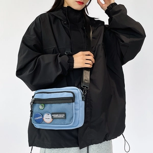 Japanese style light blue canvas crossbody bag with mesh pocket and fashion badges