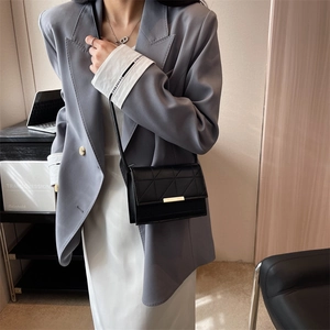 Elegant black PU leather crossbody bag with geometric stitching and gold buckle