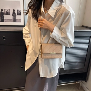 Beige quilted crossbody bag for women with gold metal clasp and thin leather strap
