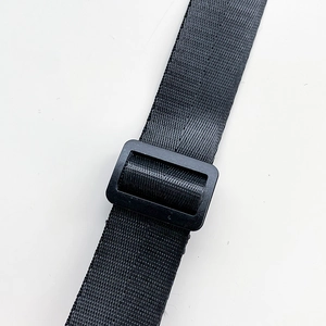 Detail of durable black nylon shoulder strap with adjustable plastic slider buckle