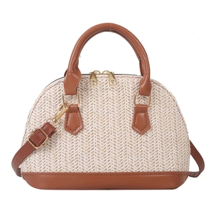 Women's shell-shaped woven crossbody bag with straw texture and brown leather trim