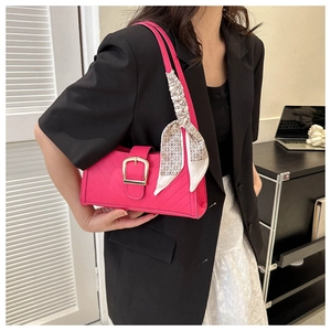 Hot pink quilted baguette bag with gold buckle and vintage geometric silk scarf detail
