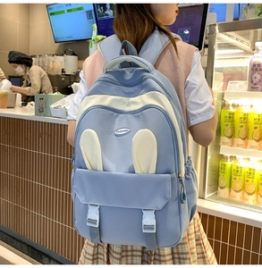 Cute light blue and cream school backpack with rabbit ears and multi-pocket design