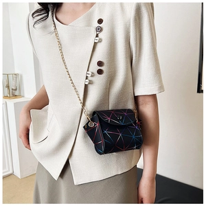Detailed view of women's geometric laser crossbody bag with metallic chain strap and flap