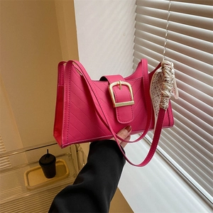 Rose pink baguette shoulder bag with quilted texture and geometric silk scarf detail