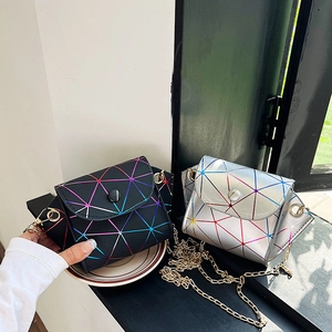 Mini geometric laser quilted crossbody bags in silver and black with gold chains