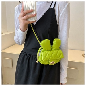 Neon green rabbit ear crossbody bag featuring quilted lattice pattern and gold chain strap