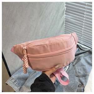 Detailed macro view of pink nylon fabric texture with braided knot zipper puller details