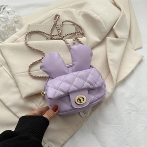 Purple quilted faux leather rabbit ear crossbody bag with gold chain and turn-lock