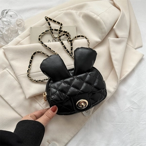 Cute black mini crossbody bag with rabbit ears, quilted pattern and gold chain strap
