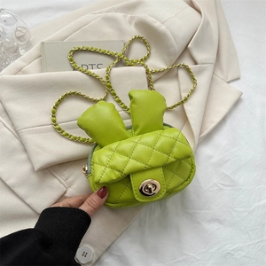Mini green quilted shoulder bag with bunny ears and a gold chain strap for women