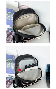 Detailed view of black nylon backpack interior showing laptop compartment and mesh pockets