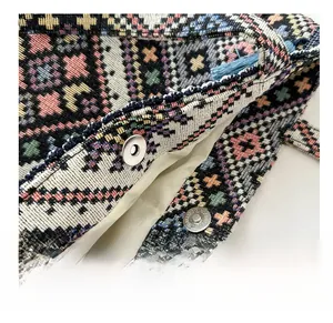 Detailed close-up of a sturdy magnetic snap closure on an ethnic woven tote bag