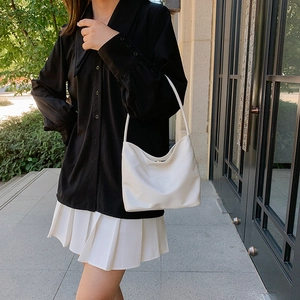 Minimalist white nylon shoulder bag with onwards and upwards embossed design for women