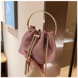 Detailed close-up of sparkling rhinestone bucket bag with golden ring handle and chain