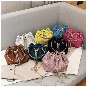 Detailed array of sparkling rhinestone bucket bags in eight vibrant colors with gold rings
