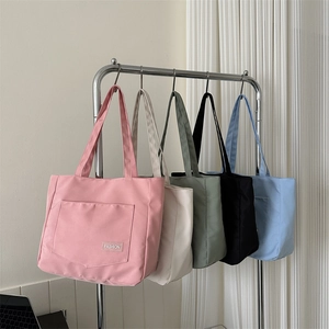 Minimalist nylon tote bags in five pastel colors with fashion label for stylish commuting