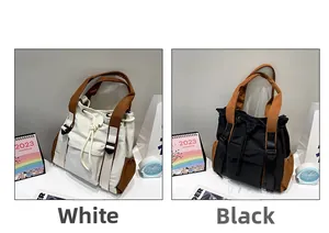 Detail view of large capacity nylon tote bags with drawstring closure and buckles