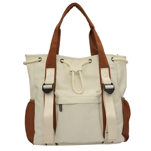 Large capacity color-block tote bag in off-white canvas with brown handles and front pockets