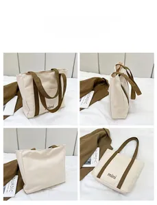 Multiple views of a cream canvas tote bag with olive green straps and mini text print