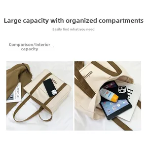 Detail view of large canvas tote bag with internal compartments for tablet and essentials