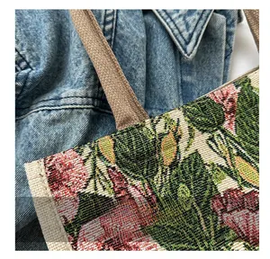 Close-up of vintage floral jacquard canvas tote bag with pink rose patterns
