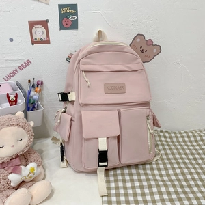 Pink multi-functional backpack detail with buckle straps and stylish pockets for school