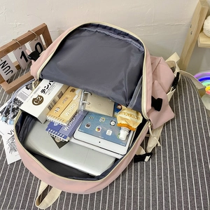 Detail view of pink student backpack main compartment with laptop and tablet storage