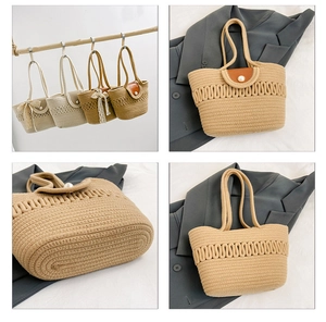 Detail of hand-woven straw handbags with pearl buckle and decorative lace ribbon