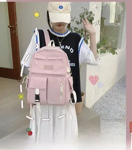 Pink waterproof nylon school backpack for students featuring multiple functional pockets