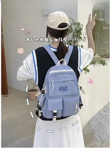 Light blue canvas backpack for school students with multi-pocket design and NULKAER logo