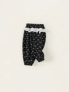 Girls black bow-print joggers with white lace trim and elastic cuffs for kids