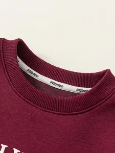 Classic burgundy crewneck sweatshirt for boys featuring ribbed collar and neck tape detail