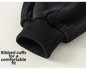 Macro shot of ribbed cuffed design on black knitted boys' school style trousers